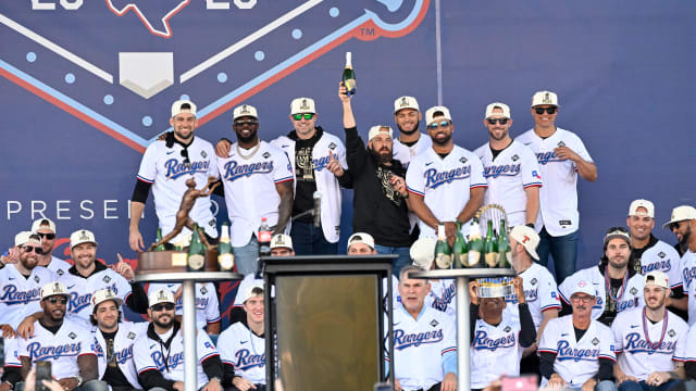 The Texas Rangers pose for a photo during the celebration outside of the ballpark after the World Series championship parade at Globe Life Field.